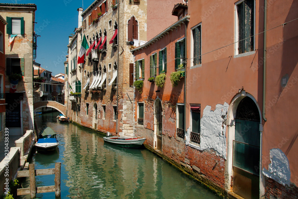 View of houses and canal street with bridge in the old town Venice Italy