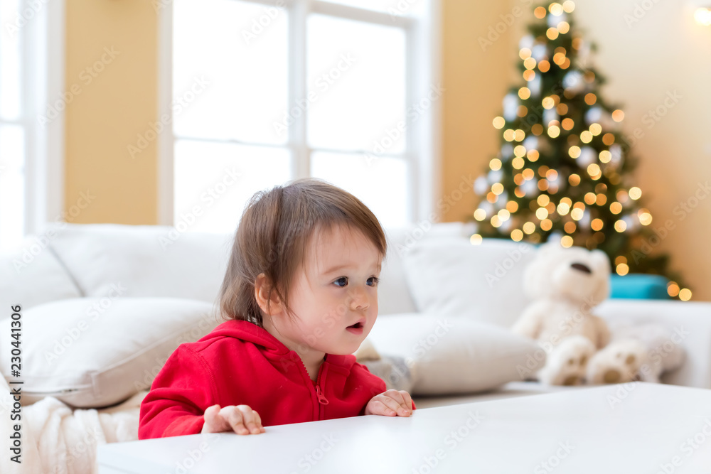 Happy toddler boy playing on Christmas morning Happy toddler boy playing on Christmas morning