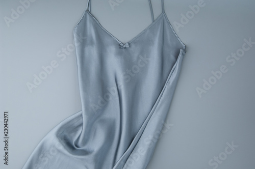 Canvastavla female nightgown on a gray background, isolated, top view
