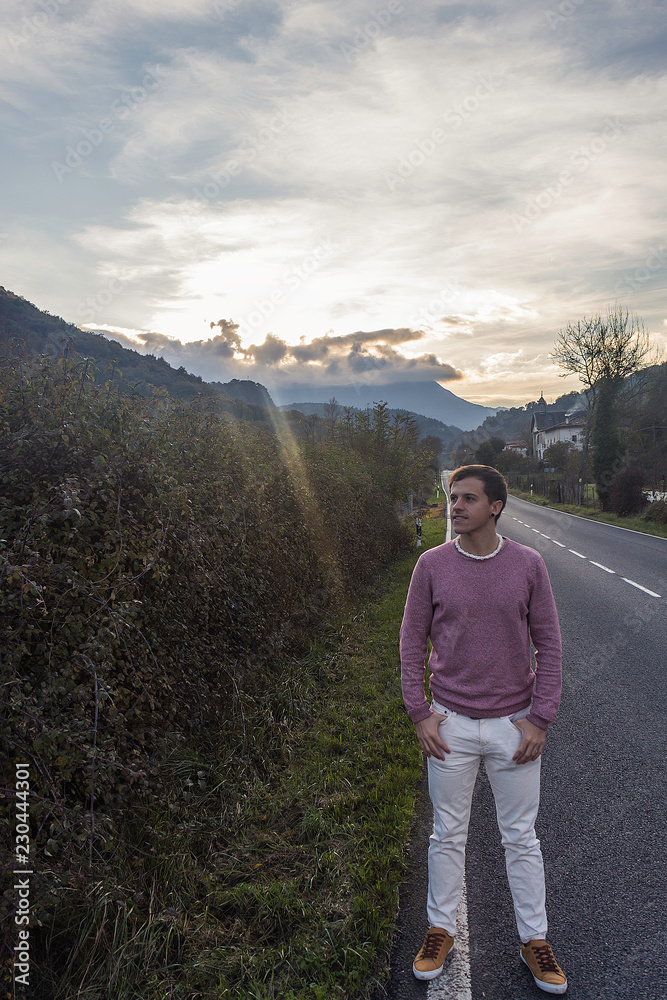 Naklejka premium Model posing with amazing sunset