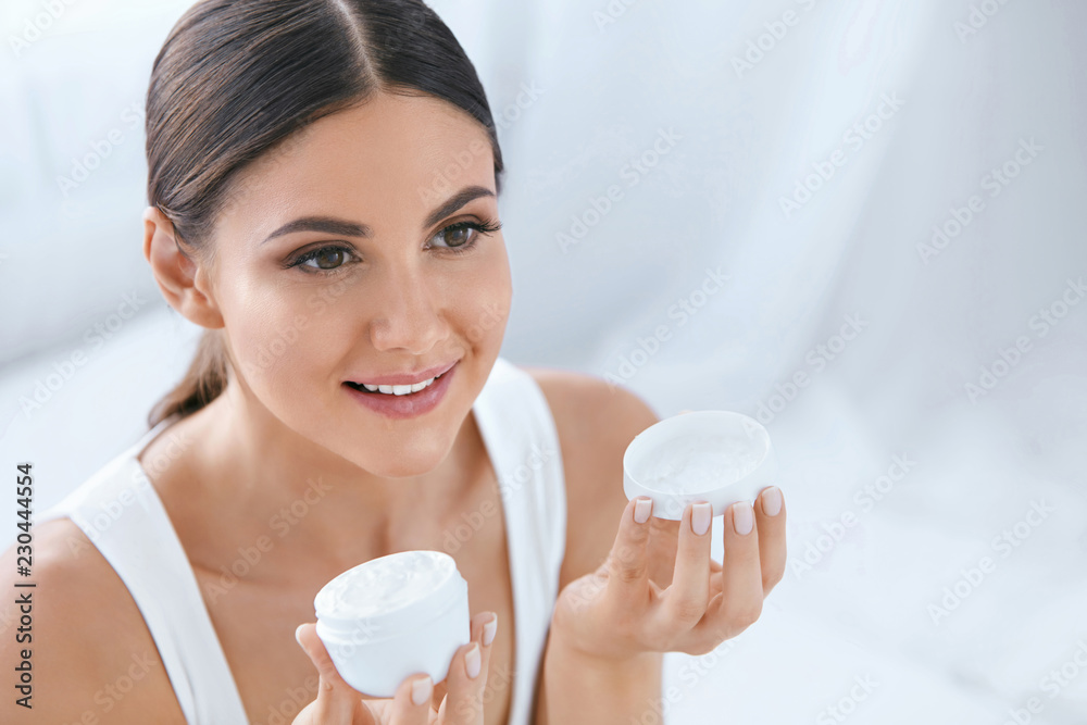 Skin Care. Woman With Natural Face Beauty Holding Facial Cream Skin Care. Woman With Natural Face Beauty Holding Facial Cream