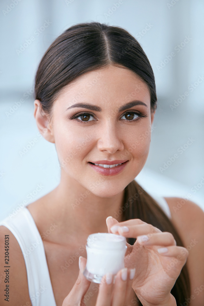 Face Skin Care. Beautiful Woman With Facial Cream. Cosmetics Face Skin Care. Beautiful Woman With Facial Cream. Cosmetics