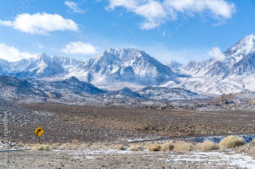 A snow covered dirt road to the Sierra Nevada mountains
