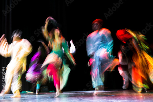 Afghan dancers perform a traditional dance photo