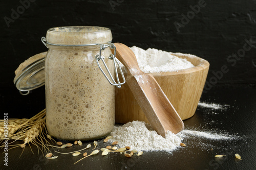 Active rye sourdough in a glass jar for homemade bread.