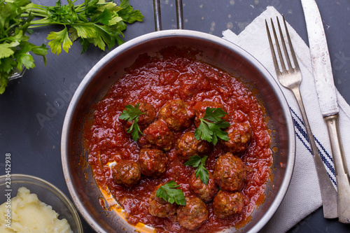 close up of meatballs, tomato sauce and mash