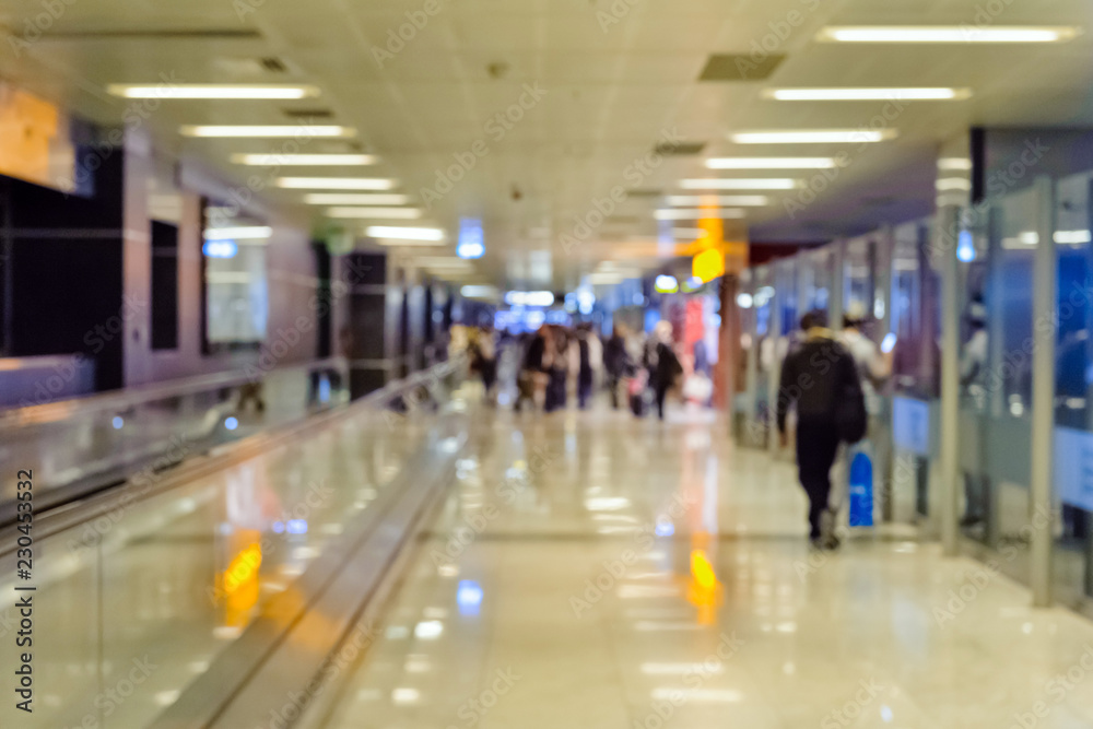 Airport corridor with passengers, defocus Airport corridor with passengers, defocus