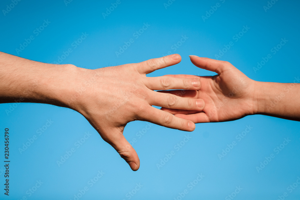 The hand is drawn to the hand. Against a beautiful, blue sky The hand is drawn to the hand. Against a beautiful, blue sky