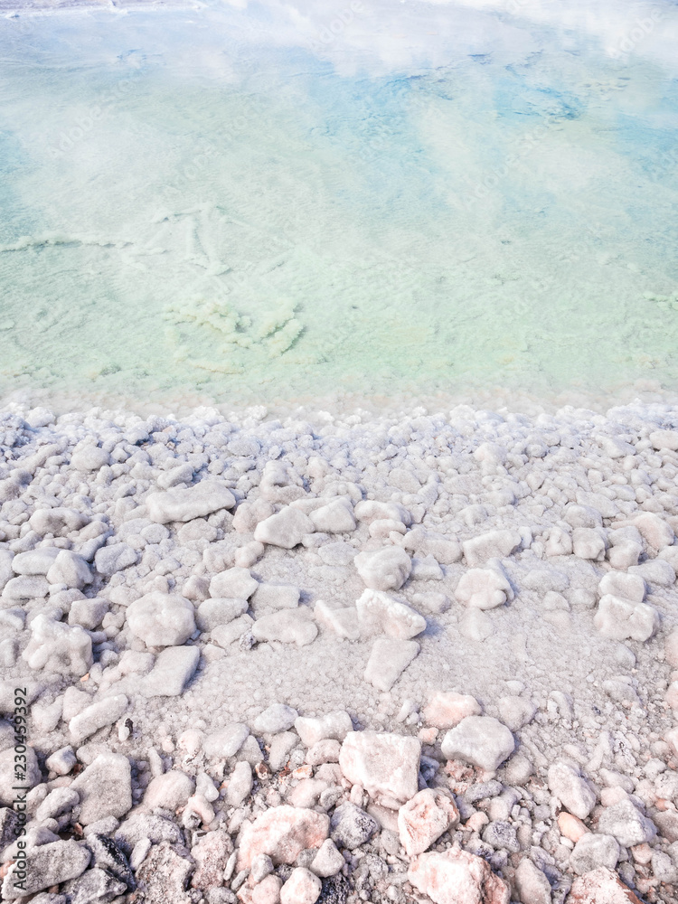 The stones are covered with a crust of salt on the shores of the salar Baskunchak. Extraction of salt The stones are covered with a crust of salt on the shores of the salar Baskunchak. Extraction of salt