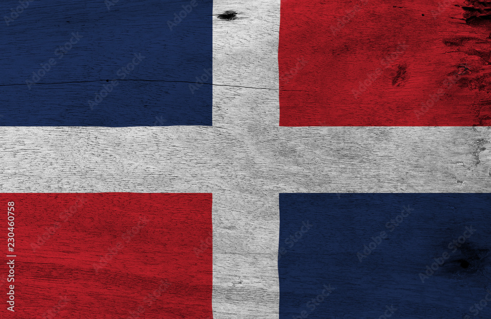 Flag of Dominican on wooden plate background. Grunge Dominican flag texture, A white cross into four rectangles, blue and red at the top and red and blue at the bottom. Flag of Dominican on wooden plate background. Grunge Dominican flag texture, A white cross into four rectangles, blue and red at the top and red and blue at the bottom.