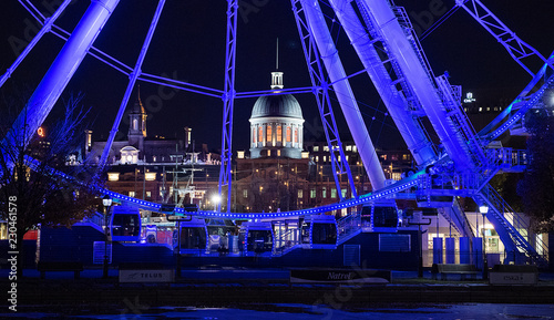 Bonsecours Market is shown behind a ferris wheel in the Old Port of Montreal photo