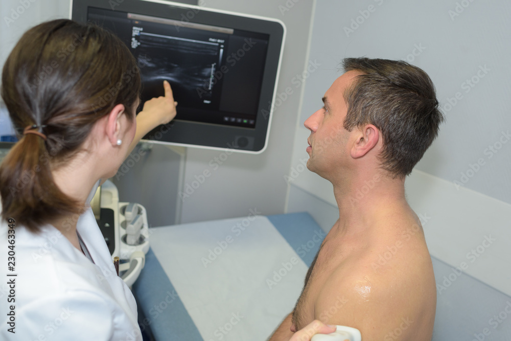 man having a therapy ultrasound man having a therapy ultrasound