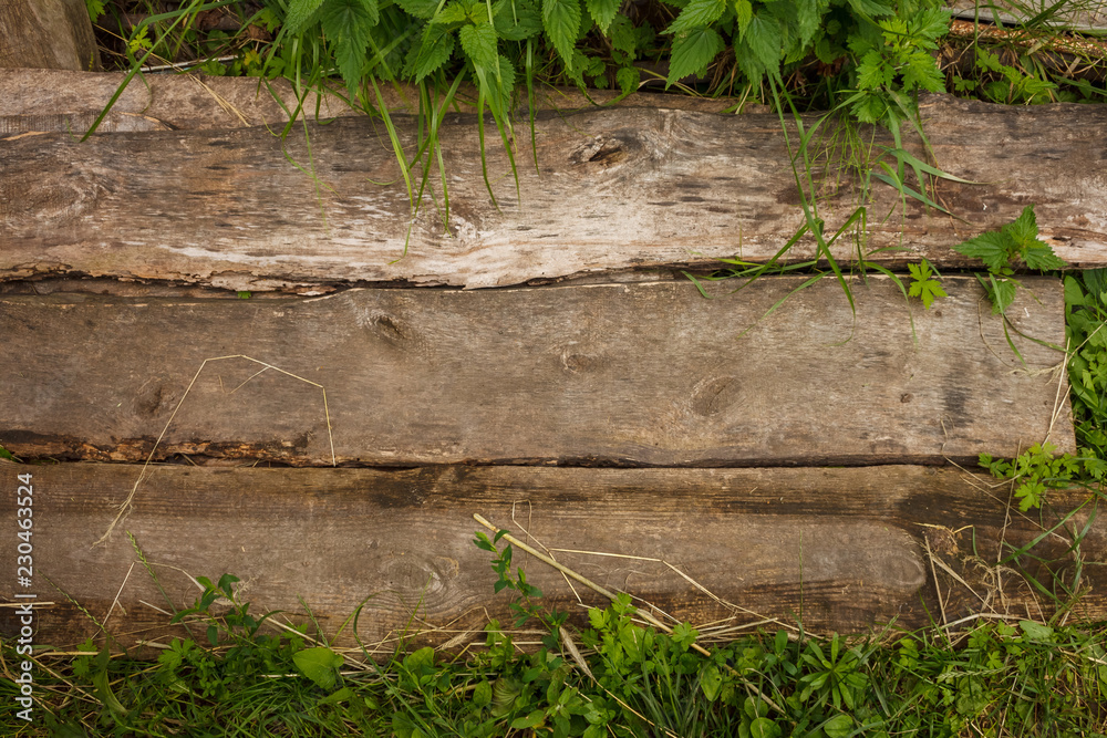 Wooden boards lie on the grass Wooden boards lie on the grass