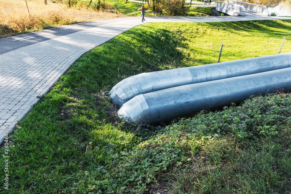 Modern Elevated Heat Pipes. Pipeline above ground, conducting heat to