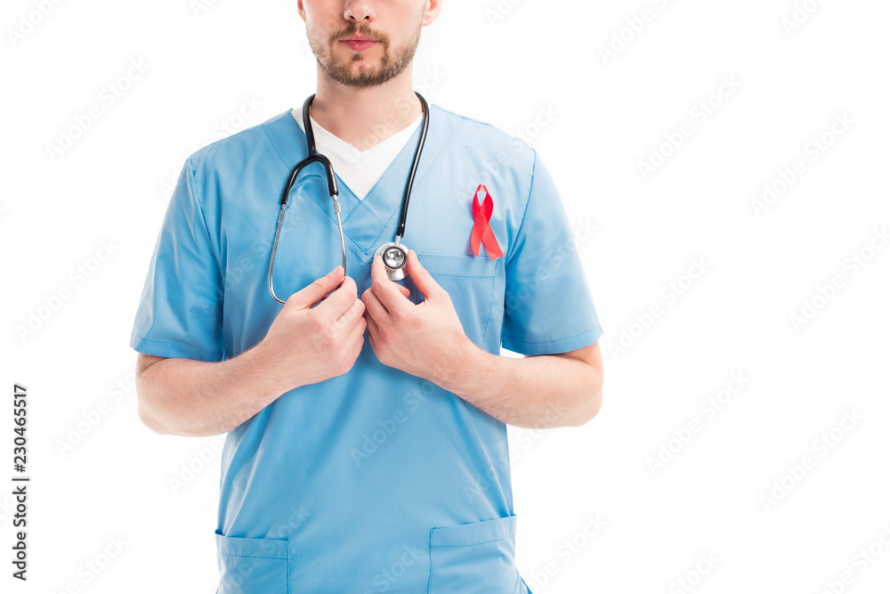 cropped image of doctor with red ribbon touching stethoscope isolated on white, world aids day concept cropped image of doctor with red ribbon touching stethoscope isolated on white, world aids day concept