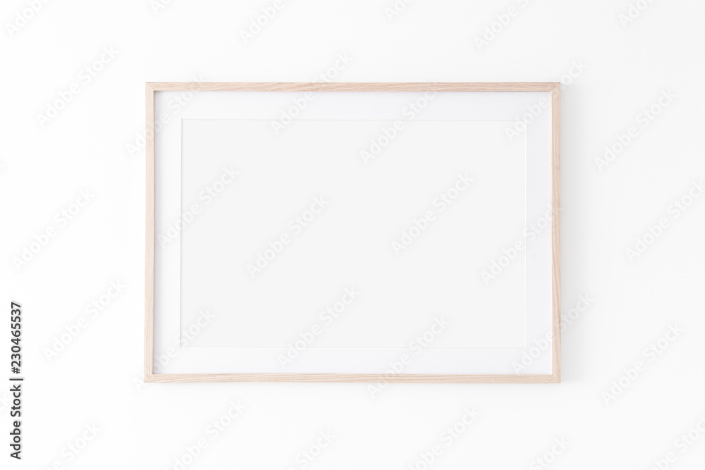 Landscape large 50x70, 20x28, a3,a4, Wooden frame mockup with passe-partout  on white wall. Poster mockup. Clean, modern, minimal frame. Empty fra.me  Indoor interior, show text or product Stock Photo
