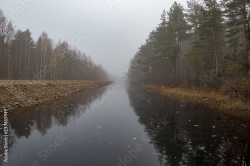 foggy landscape over water autumn in sweden