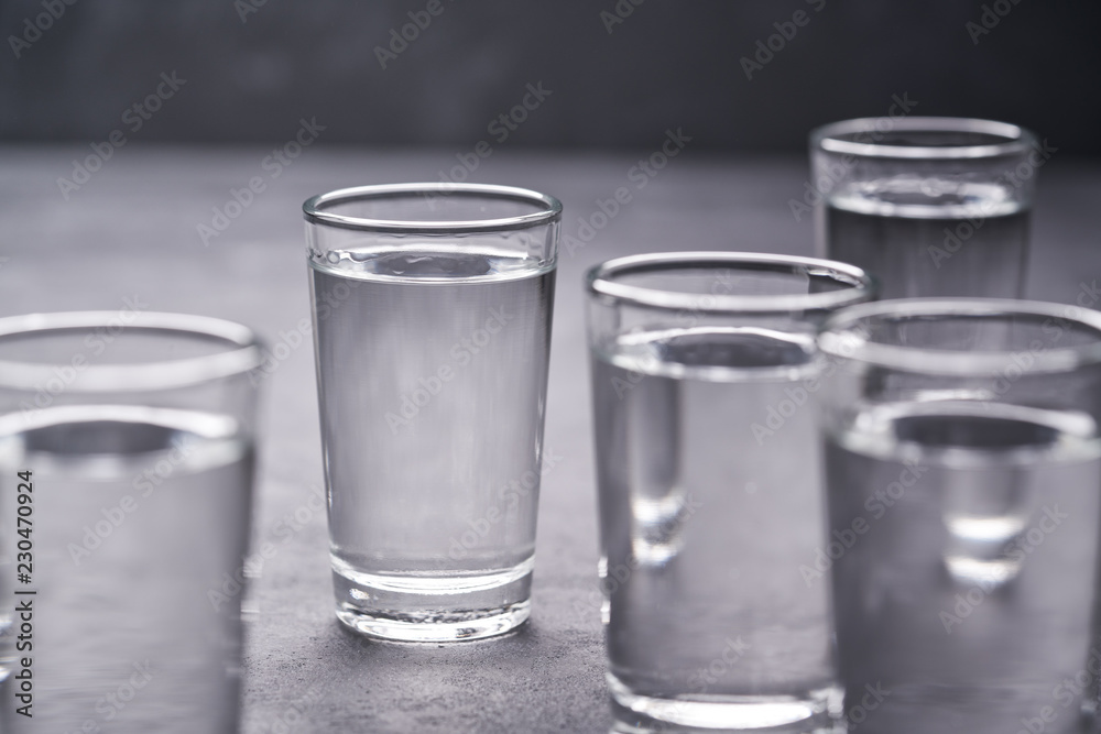 Russian vodka shots on black table, copy space Russian vodka shots on black table, copy space