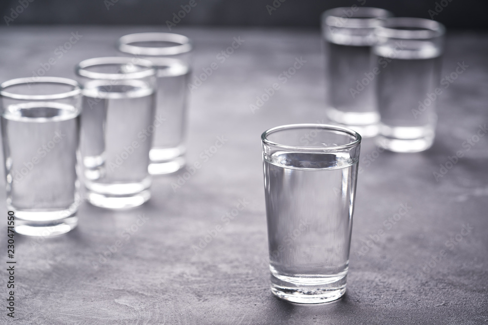 Russian vodka shots on black table, copy space Russian vodka shots on black table, copy space