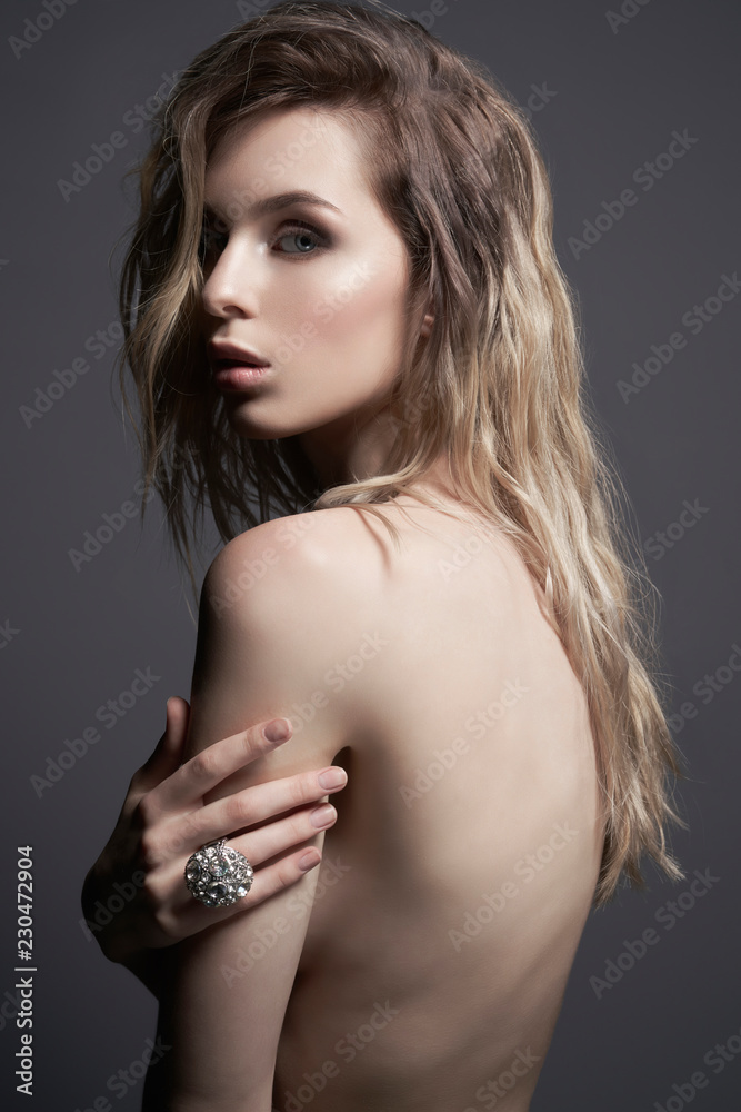 Young beautiful blonde with silver jewelry Young beautiful blonde with silver jewelry