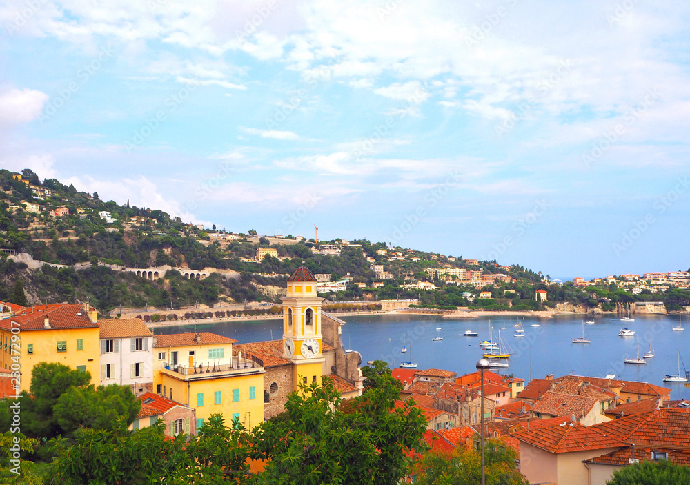 View of luxury resort Villefranche-sur-Mer, old city and bay on French Riviera at Mediterranean Sea. Cote d'Azur. France.