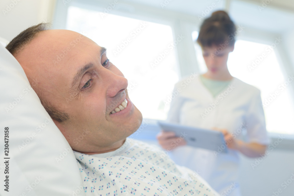 Fototapeta premium happy patient lying on hospital bed