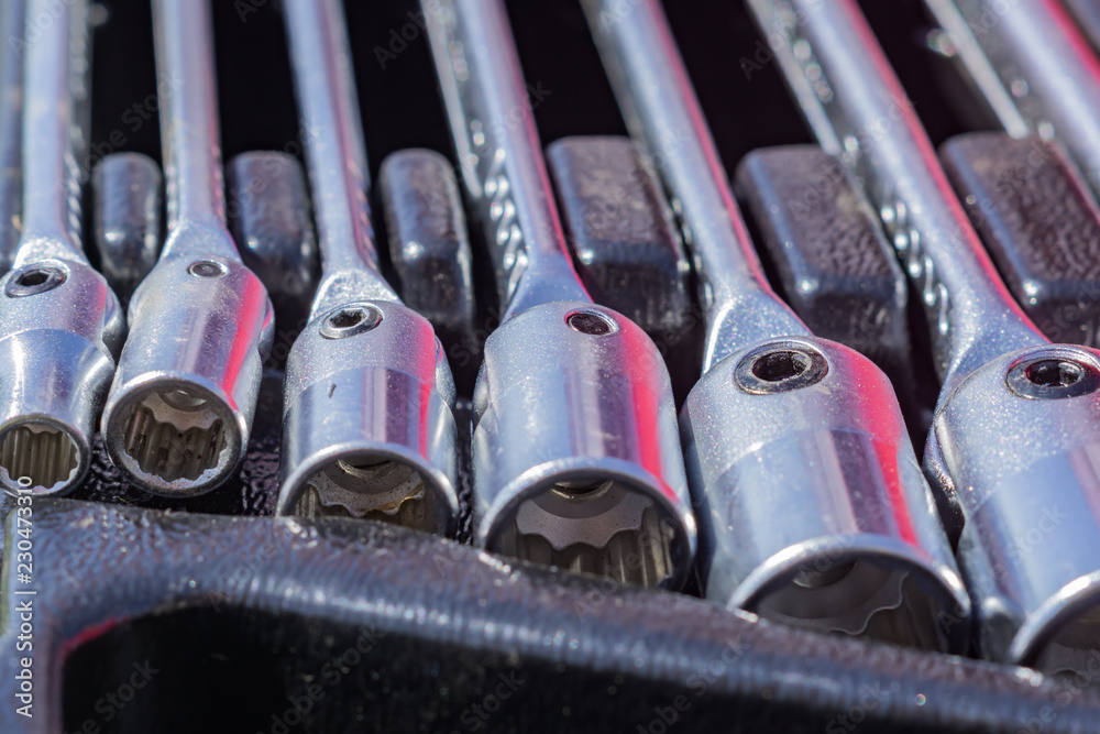 Fototapeta premium set of socket wrenches in a case, close up of workers tools, selective focus