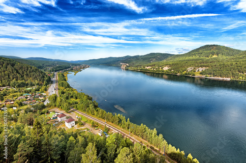 scenic aerial panoramic landscape overview of russia siberia river yenisei in krasnoyarsk region at late summer autumn nature wonderland with outside scenery taiga forest mountain reflection on water
