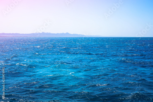 Beautiful blue sea surface with the sky. Oceanic deserted  lonely theme for background. Stock photo for tourist design
