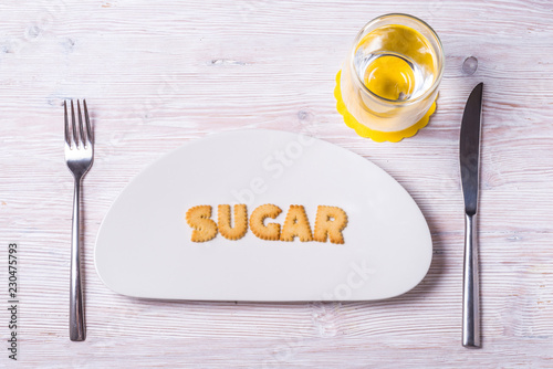 Biscuit letters on porcelain plate, Sugar