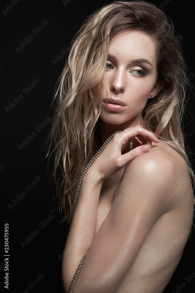 Young beautiful blonde with silver necklace