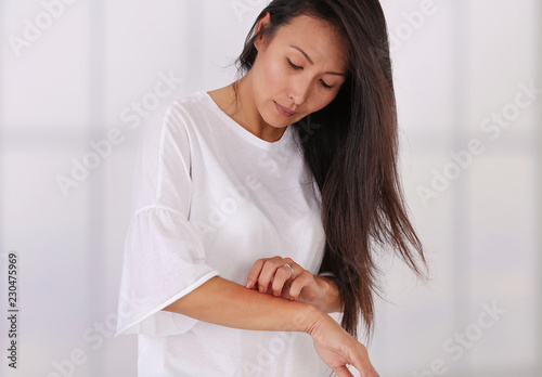 Photography Asian Woman Scratching an itch on white background