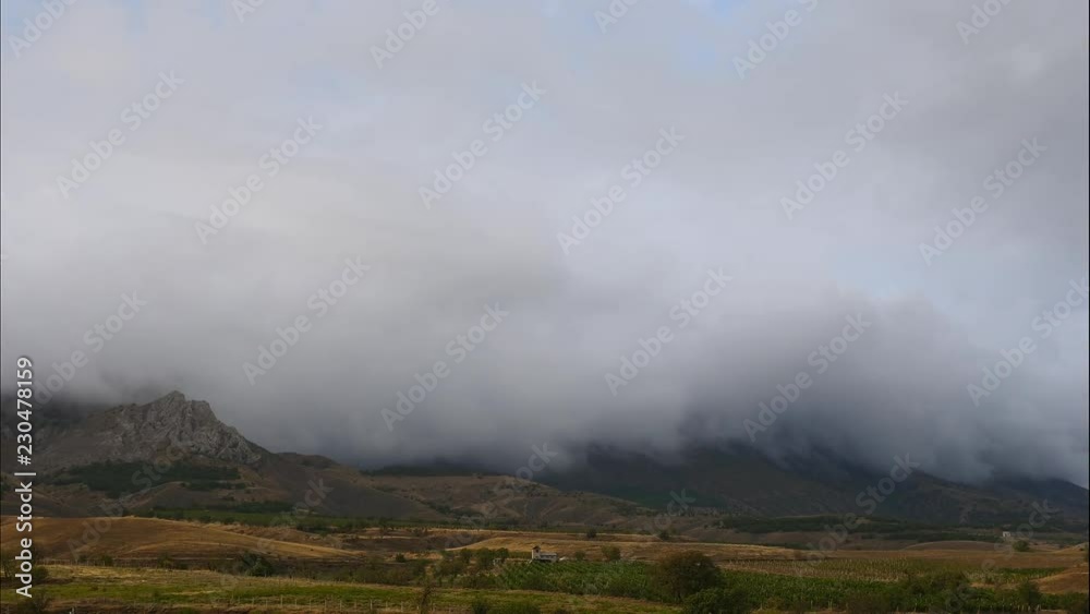 Mountains in the background of gray clouds. Dark clouds envelop the tops of the mountains. best types of mountain ranges. Beautiful view of the mountains. best video of steep cliffs. Torrential rain Mountains in the background of gray clouds. Dark clouds envelop the tops of the mountains. best types of mountain ranges. Beautiful view of the mountains. best video of steep cliffs. Torrential rain