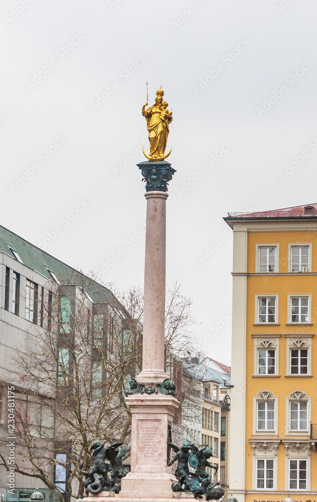 The Golden statue of Mary (Mariensaule), a Marian column on the Marienplatz  in Munich,Germany