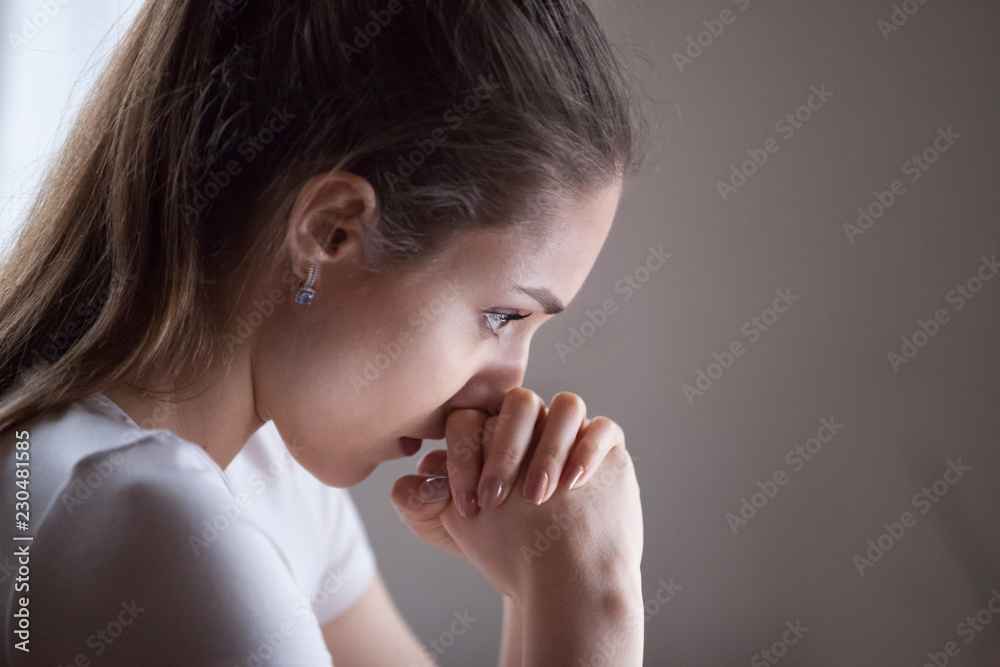 Close up serious pensive woman thinking or having doubts. Portrait face of millennial attractive perplex confused girl feels irresolutely making important difficult decision in personal life or work