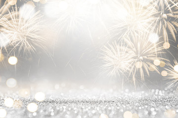 Gold and silver Fireworks and bokeh in New Year eve and copy space. Abstract background holiday.
