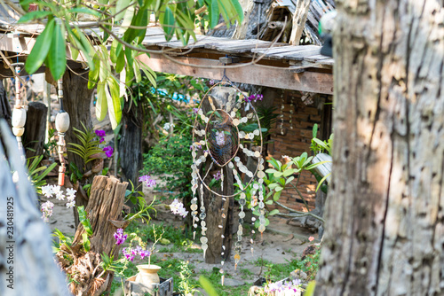 The garden of the Hippie Bar ornate with flowers, mobiles, sculptures and dreamcatcher  photo