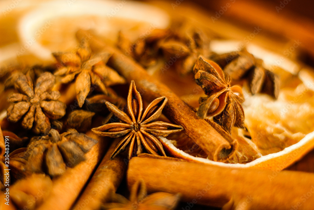 Christmas background: spices - anise stars, cinnamon sticks, selective focus Christmas background: spices - anise stars, cinnamon sticks, selective focus