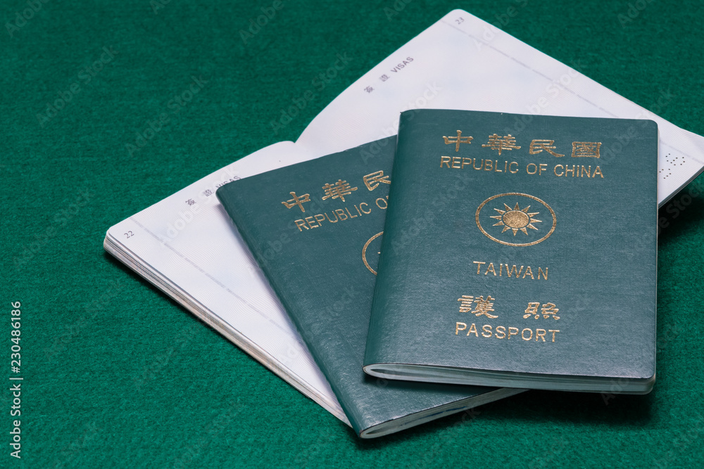 Taiwanese passports on green table Taiwanese passports on green table