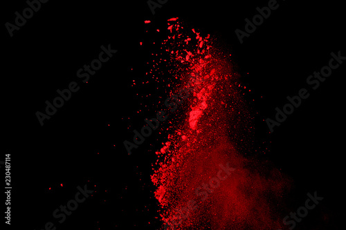 Abstract Red powder splatted background,Freeze motion of red powder exploding/throwing green dust.