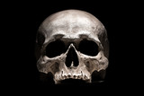 Human skull on black background close up