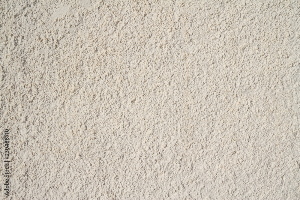 A textured white stucco background image with plenty of copyspace. A textured white stucco background image with plenty of copyspace.