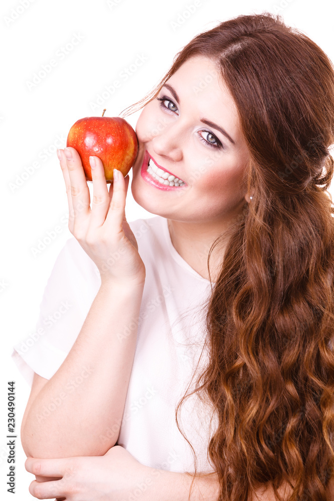 Woman holds apple fruit close to face, isolated Woman holds apple fruit close to face, isolated