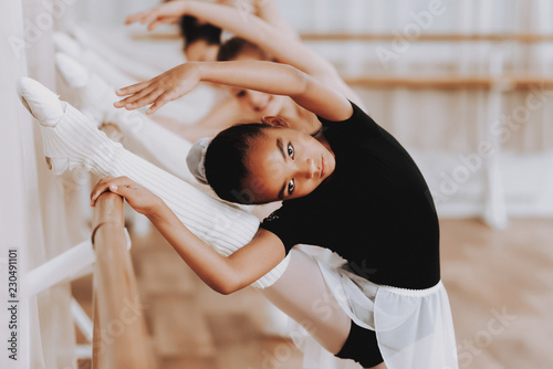 Ballet Training of Group of Young Girls Indoors.