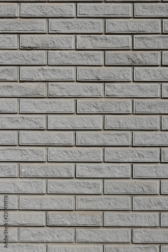 Wall of gray brick imitation granite