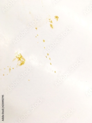 The stains of curry soup on a white wall - Round stain caused by splash of soup. © junah666