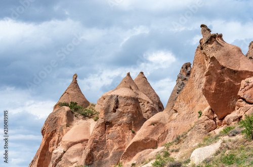 Rock formations and cave town in Zelve Valley, Cappadocia, Turkey photo