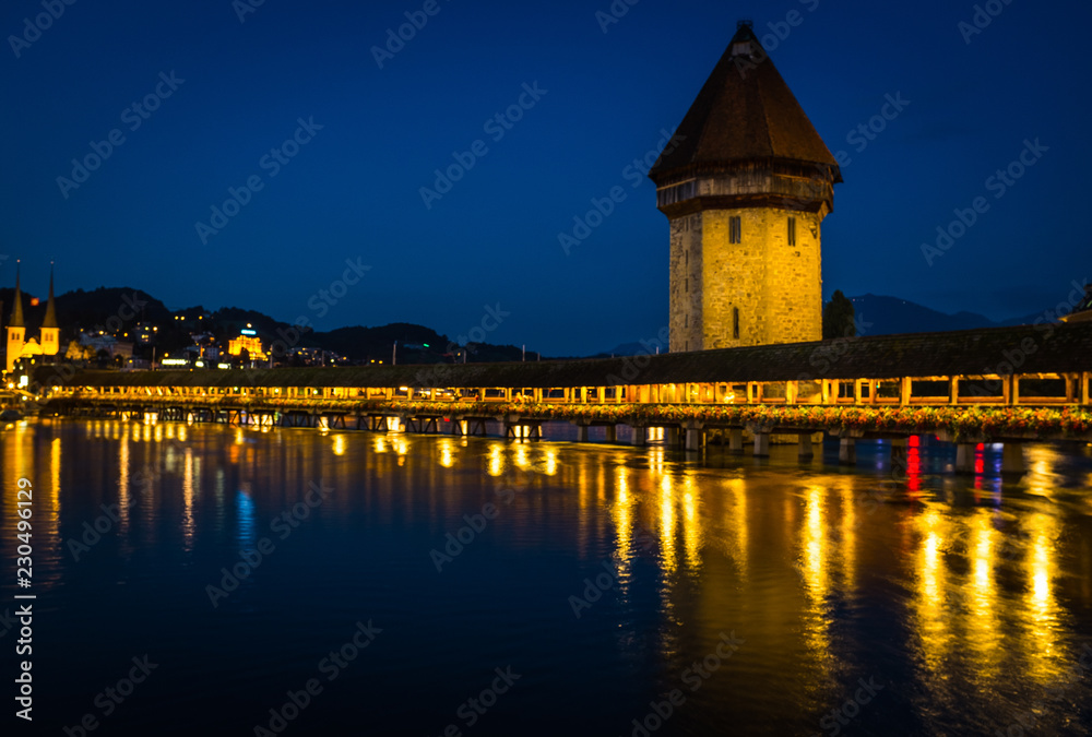 Fototapeta premium View of Chapel Bridge in Lake Lucerne at Night