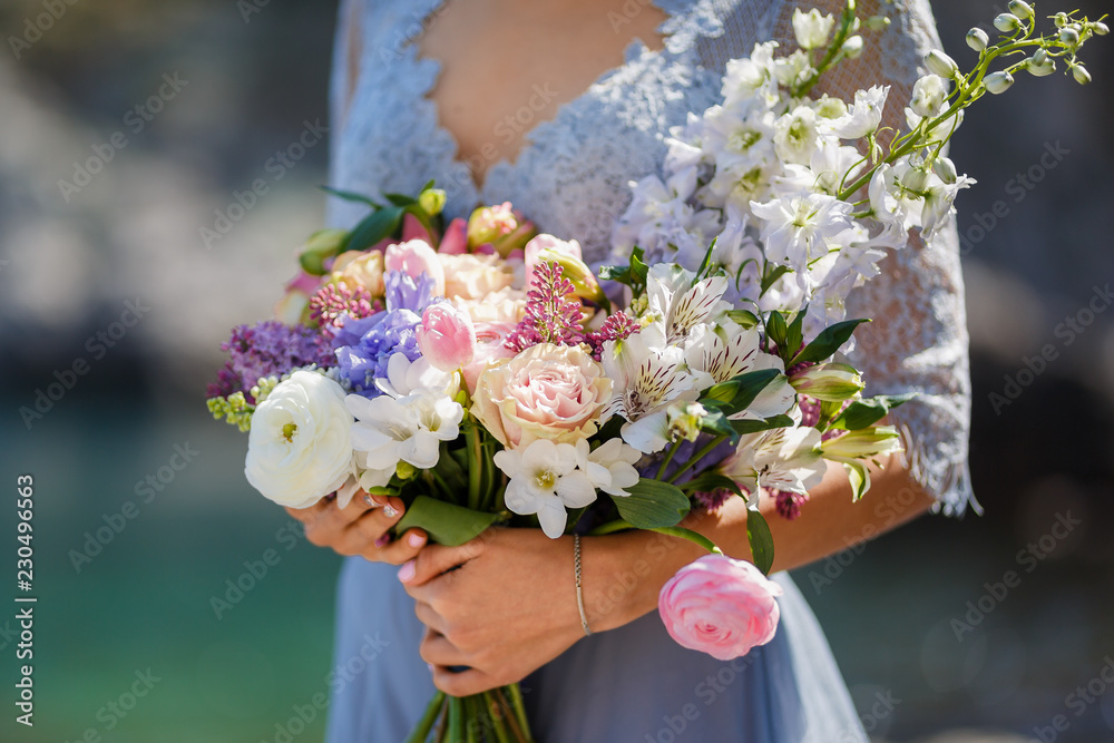 wedding bouquet in hands of bride wedding bouquet in hands of bride