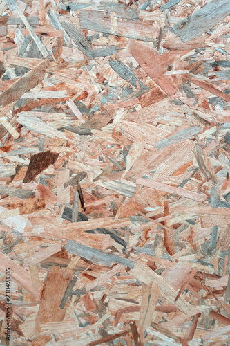 Texture of glued wood sawdust Board. 
